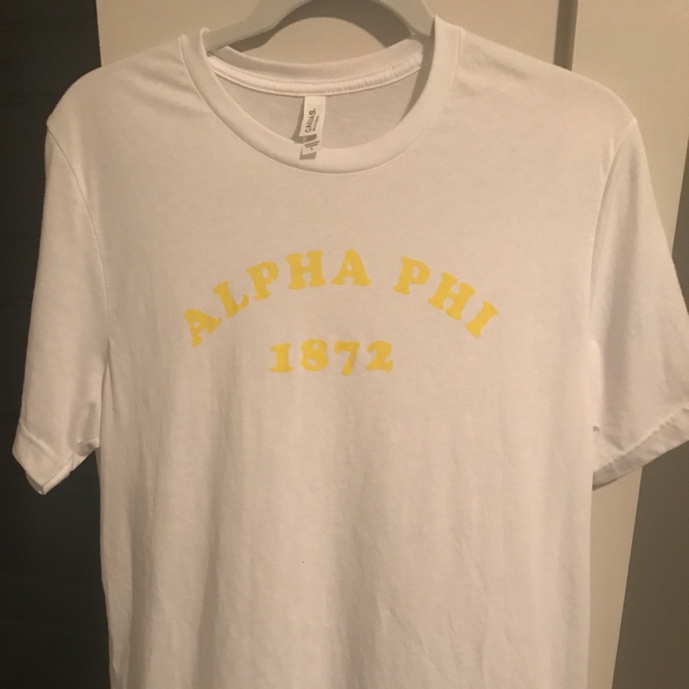 White and yellow letter alpha phi tee
